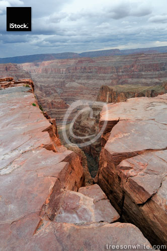 Grand Canyon Rock Crack with stormy weather background.