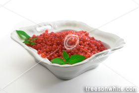 Bowl of red currants with mint leafs isolated on white.