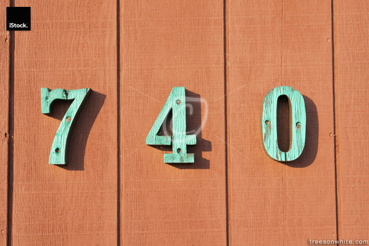 Wooden fence with house number 740