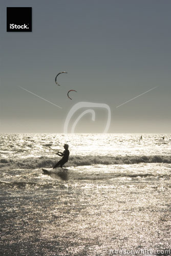 Kite surfers at sunset in California – Waddell Creek Beach.