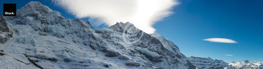 Alpine mountains panorama with Jungfraujoch and Jungfrau peak.