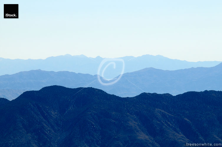 Distant row of mountains surrounding death valley with blue atmo