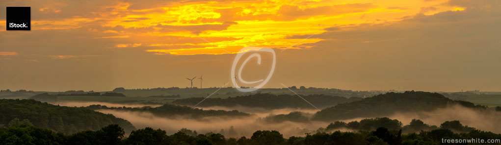 Fog landscape panorama after sunset with wind turbines, Germany,